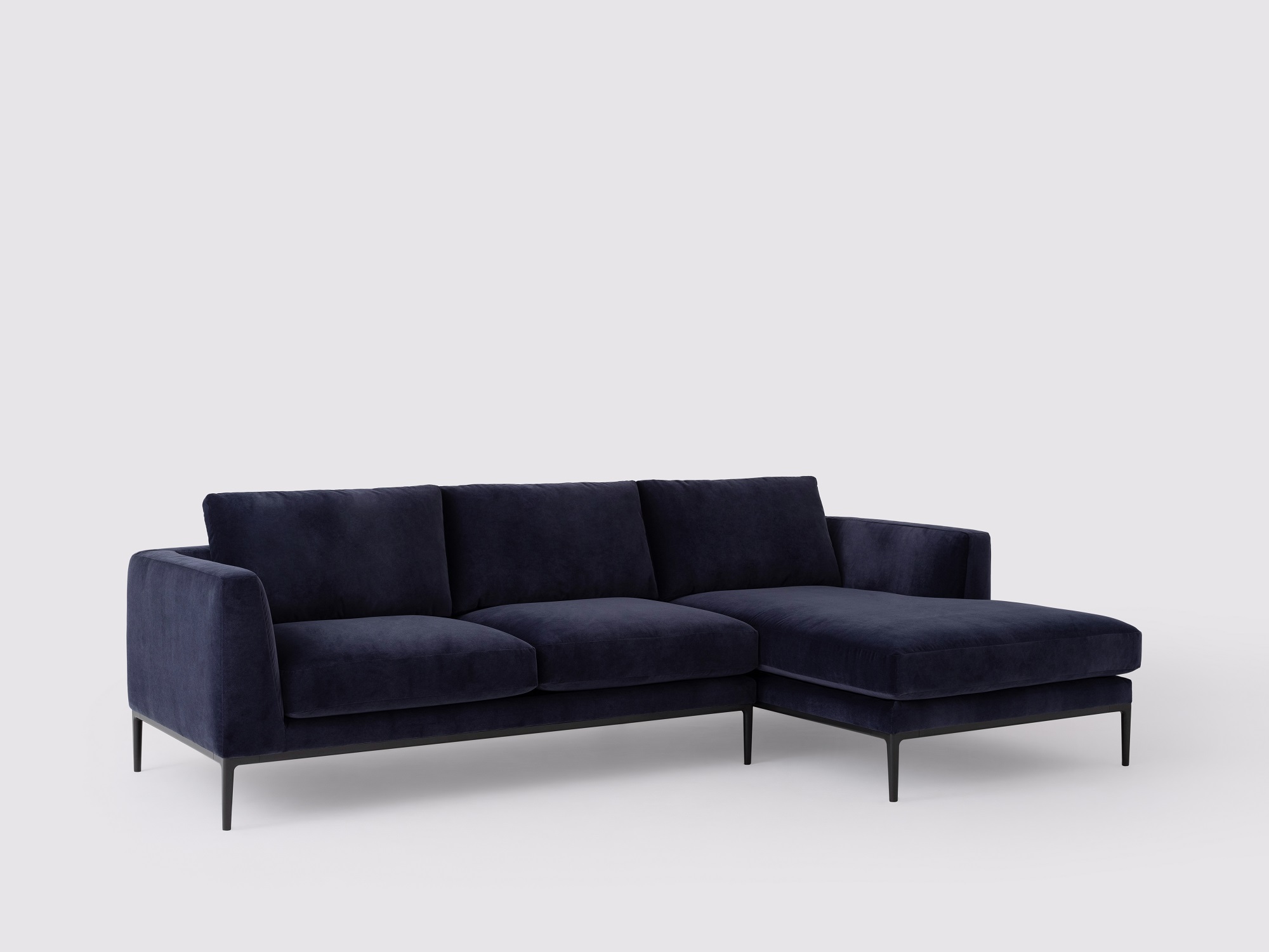 Angled view of the Oma modern sectional couch in blue velvet